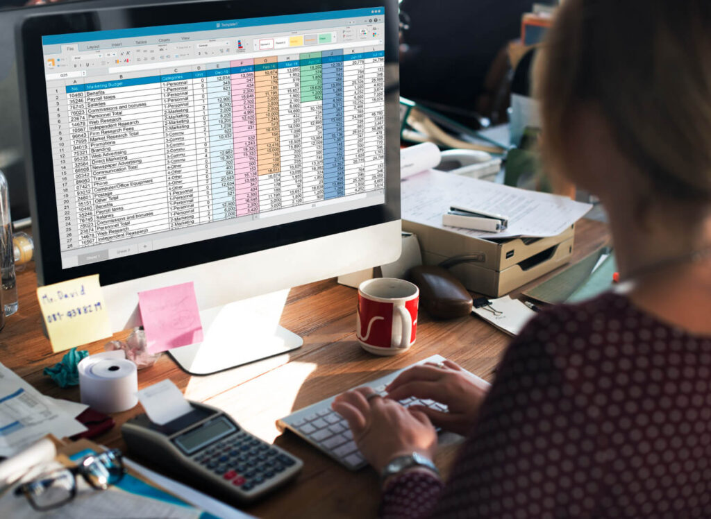 Bookkeeper managing digital ledgers and financial records for clients in the UK and US