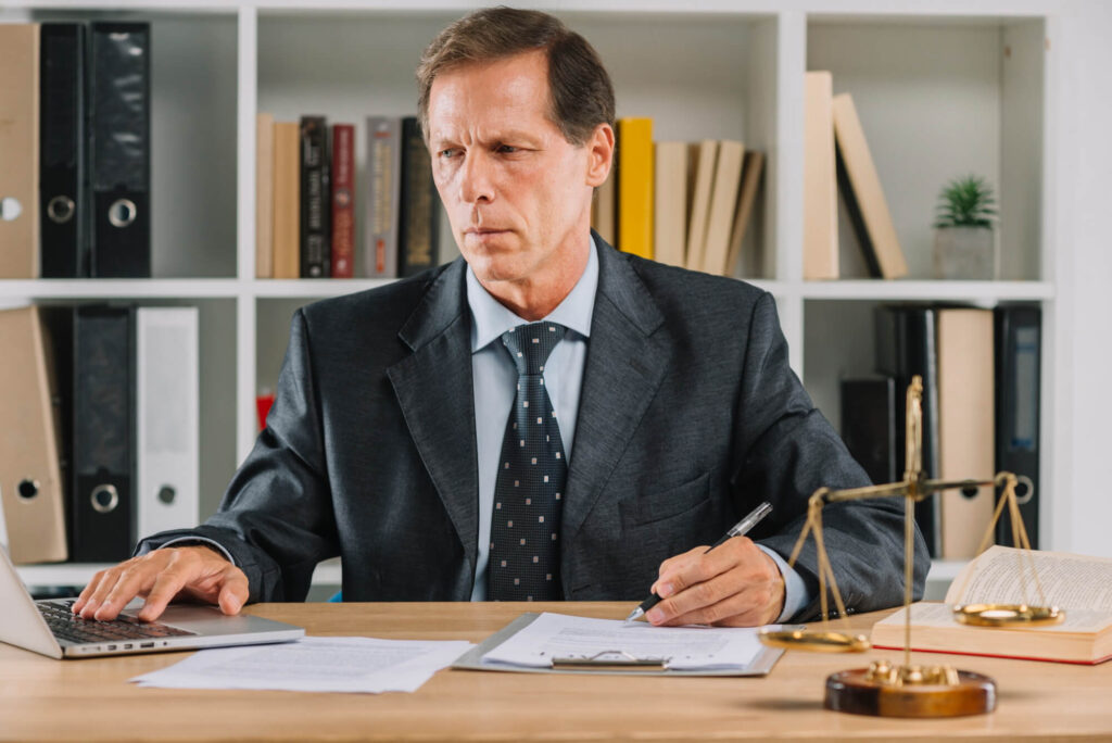 Lawyer reviewing penalty appeal documents in office – UK tax advisory