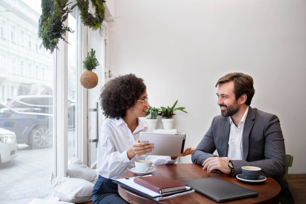 Retired couple reviewing tax-efficient pension withdrawal strategy with tax planning adviser