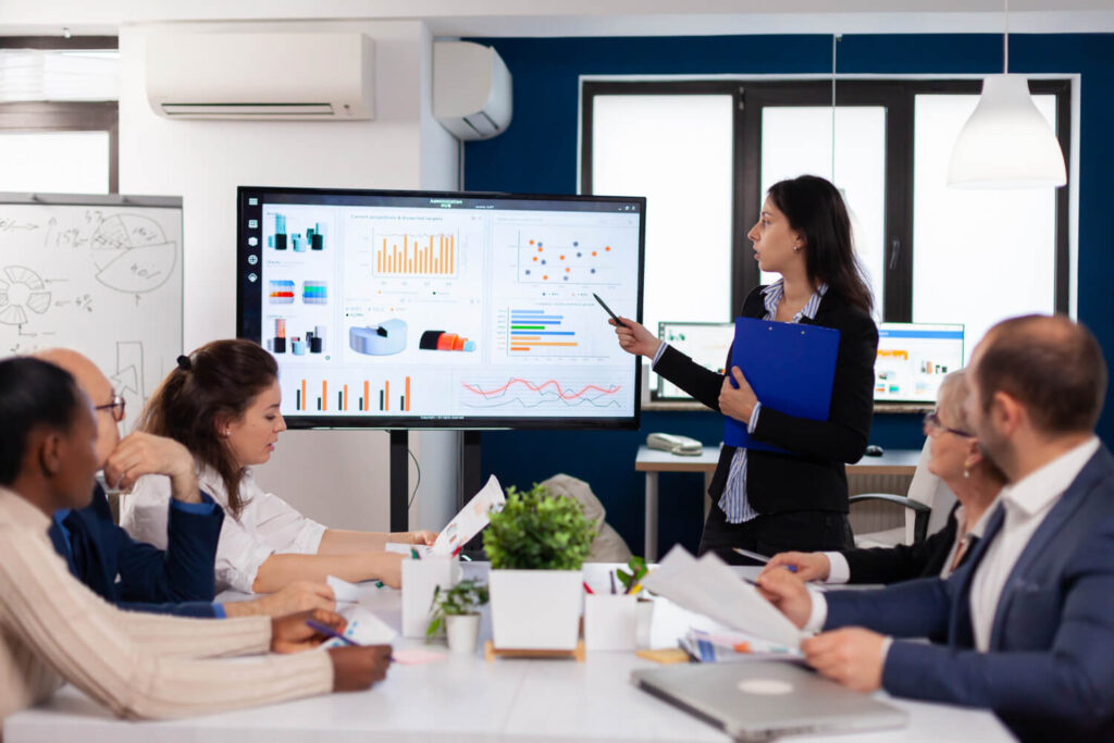 Explaining corporation tax compliance and reporting strategies during a team briefing