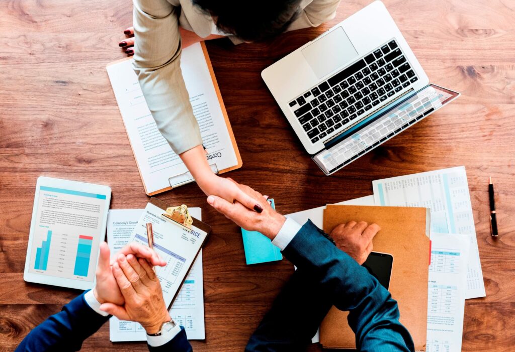 Corporate tax consultants reviewing financial data for HMRC corporation tax return submission