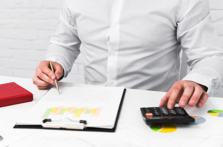 Business owner approving payroll on tablet – Audit Consulting Group online payroll service with HMRC RTI compliance and employee self-service