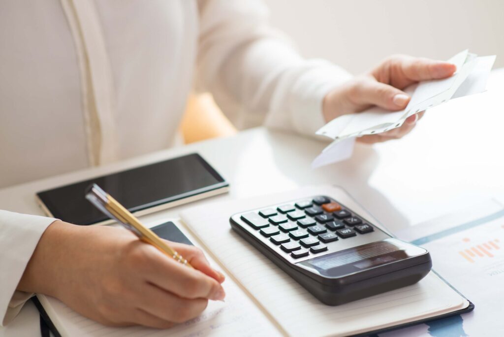 Accountant calculating tax return documents – self assessment tax return form, self employed HMRC form