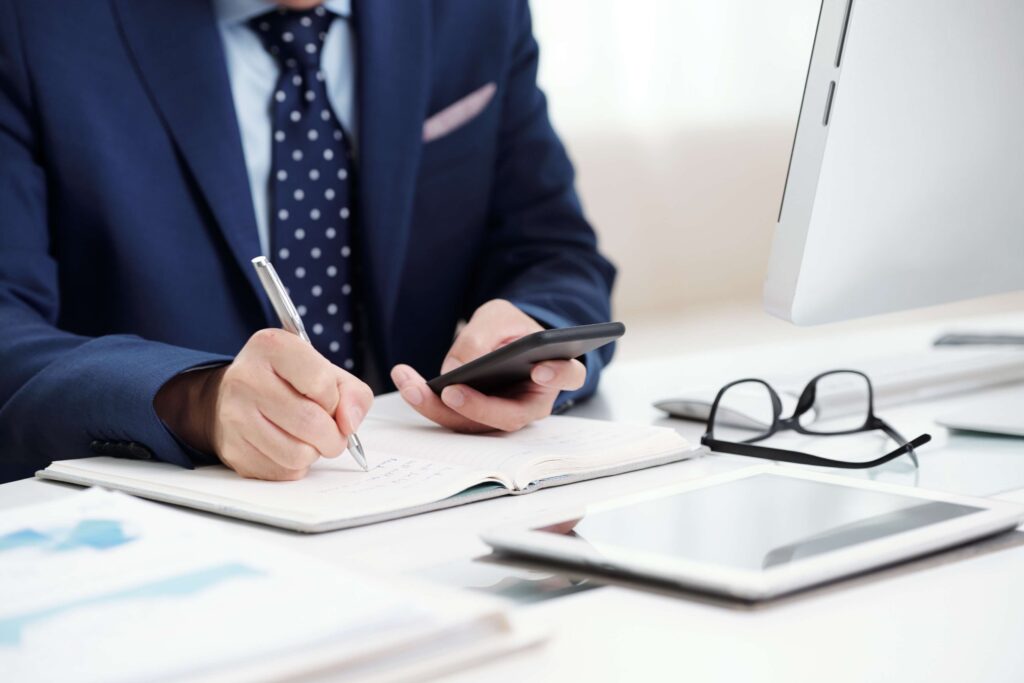 Business team completing HMRC self assessment forms and registration – HM Revenue and Customs self assessment form, register for self assessment form