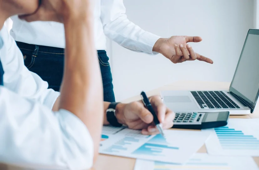 Accounting and bookkeeping team analyzing tax records and monthly reports – Audit Consulting Group UK