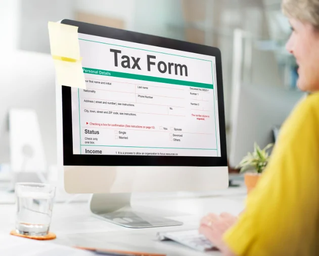 Tax consultant reviewing online tax form – Audit Consulting Group professional tax return services UK