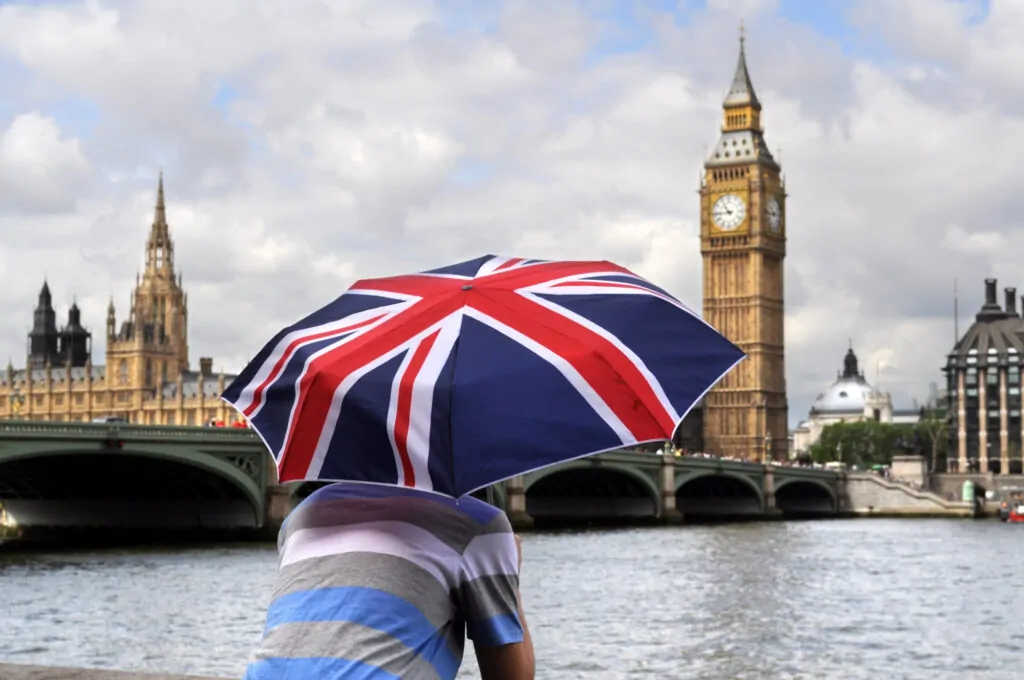 Family reviewing Universal Credit and Child Benefit forms with UK adviser